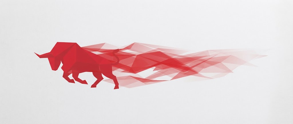 Red geometric low-poly bull charging forward with a trailing red crystalline motion streak